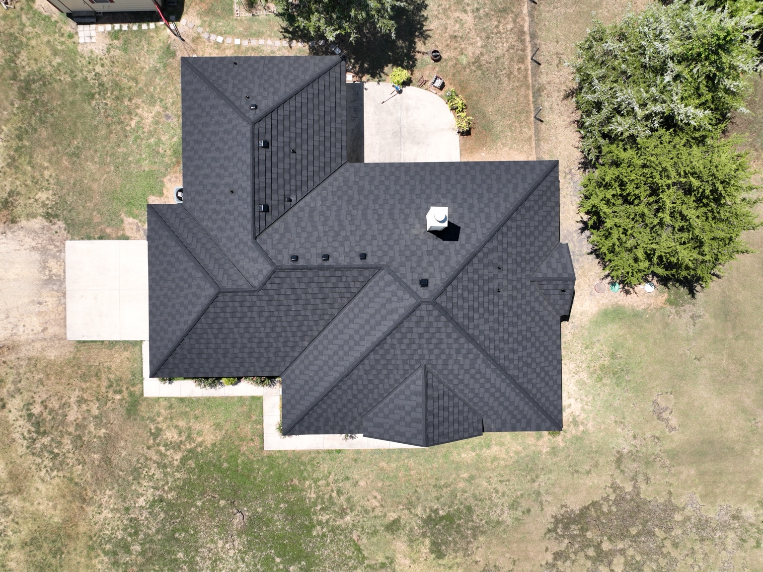 Straight-down drone view of completed dark roof